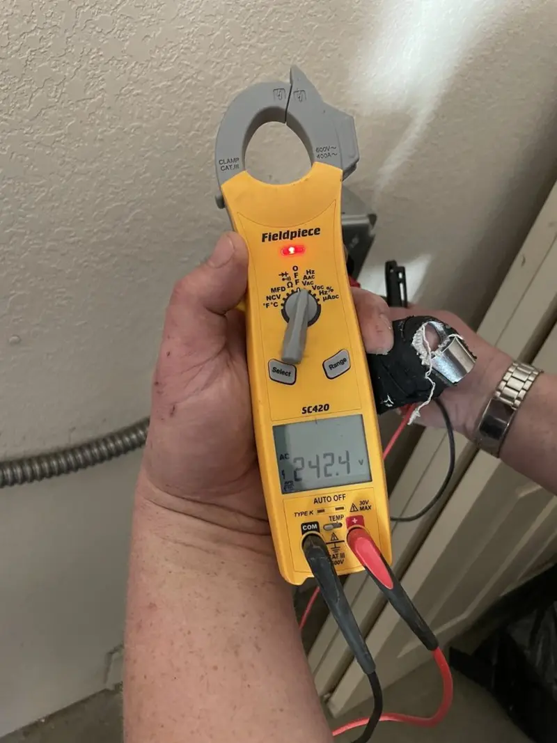 Voltage testing with clamp meter during Recessed Lighting Installation in Pima